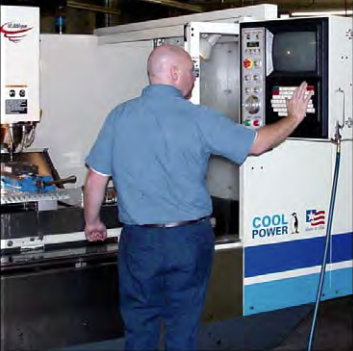 Custom automation employee testing a fabrication & assembly machine